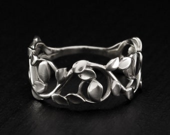 Unique dainty woman's ring with leaves made in sterling silver with shiny finish
