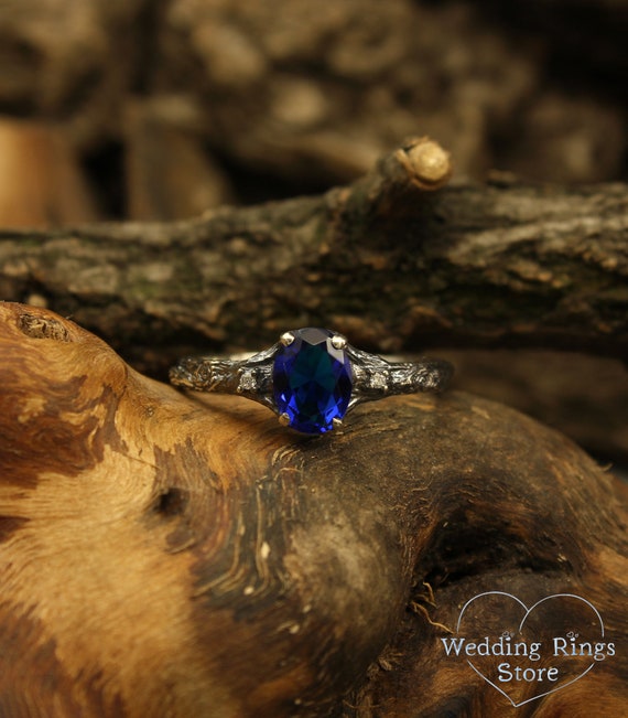 Delicate branch engagement ring made in 14k solid white gold with oval sapphire and two diamonds for bride