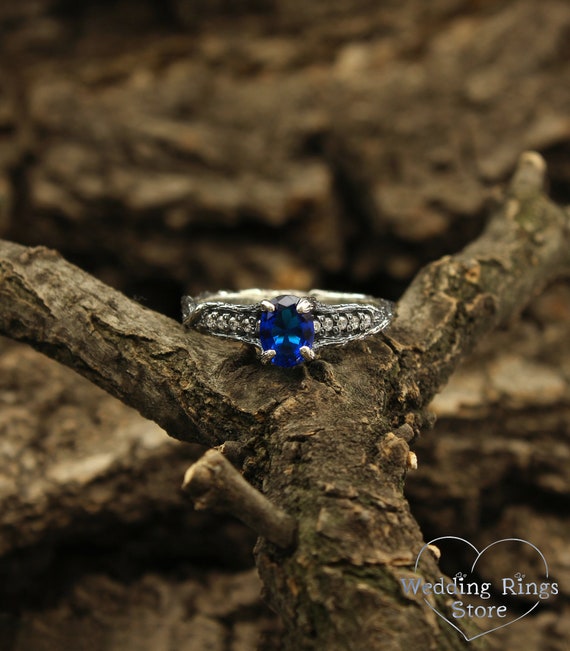 ring made of silver branches with leaves and sapphire. Gift for a woman