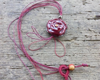 Necklace with pink subject pendant