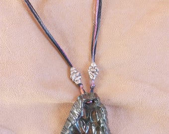 Multi-strand necklace with raku ceramic pendant