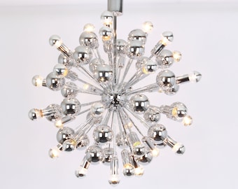May include: A chrome Sputnik chandelier with multiple light bulbs. The chandelier has a starburst design with many arms extending outward.