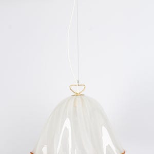 May include: White glass pendant light with a ruffled edge and a gold metal top. The light has a white cord and a gold metal ring.