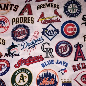 May include: White fabric featuring a collage of Major League Baseball team logos. Logos include the Mets, Dodgers, Cardinals, and others, in various colors and designs. The fabric is suitable for crafting or apparel.
