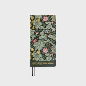 May include: A rectangular 2027 planner featuring a dark green background with a dense botanical pattern of light green leaves, yellow daisies, and pink flowers. The cover includes the text 2027 and a quote by William Morris in gold lettering.