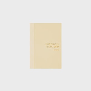 May include: A cream-coloured planner with a vertical spine detail on the left side. The front cover features gold-coloured text that reads HOBONICHI TECHO 2027 original. The planner has a clean, solid-coloured cover with a smooth, matte-like finish.