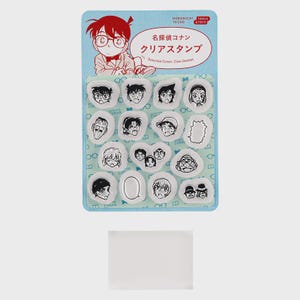 May include: A set of clear stamps featuring character faces from the Detective Conan series. The stamps are on a blue backing card with Japanese text and a cartoon illustration. Includes a clear stamp pad. Ideal for crafting.