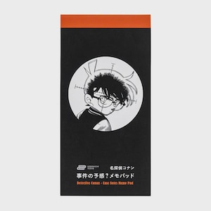 May include: Black memo pad with an orange top edge. The pad features a black and white illustration of a cartoon character with glasses inside a white circle. Japanese text and the English text "Detective Conan - Case Notes Memo Pad" are printed below the illustration.
