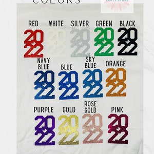 May include: A chart showing different glitter colors for the numbers 2022. The colors include red, white, silver, green, black, navy blue, blue, sky blue, orange, purple, gold, rose gold, and pink.
