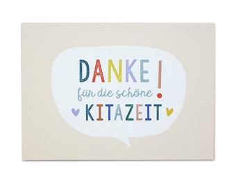 May include: A light beige card with a speech bubble in the centre. The speech bubble has the text "DANKE!" in colourful letters, followed by "für die schöne" in black letters, and "KITAZEIT" in colourful letters. There are two small hearts on either side of the text.