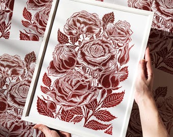 May include: A framed red and white print of a floral arrangement featuring a bouquet of roses with detailed linework. The roses are arranged in a cluster with leaves and stems.