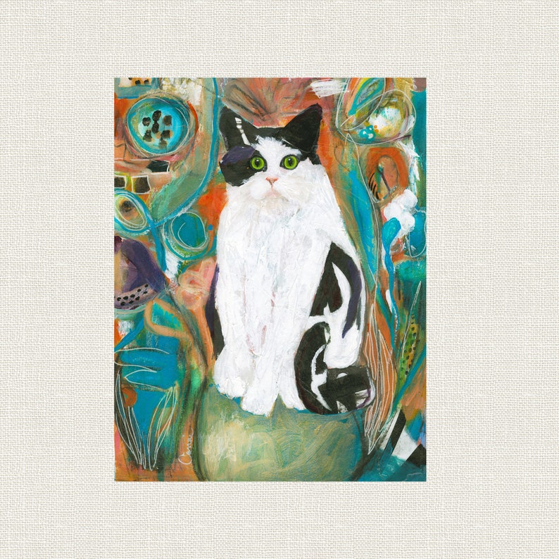 May include: A black and white cat with green eyes sits in a green pot with a colorful abstract background. The cat is looking directly at the viewer.