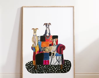 May include: Three greyhounds sitting on a colourful patchwork armchair. The armchair has a black and white polka dot rug underneath. The dogs are looking at the camera.