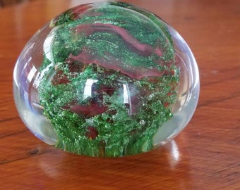 Red and sparkle green paper weight