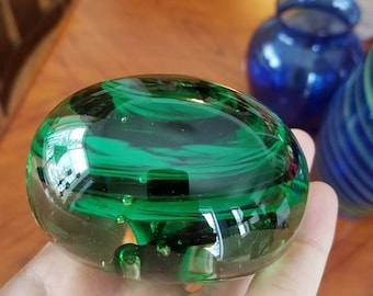 Black and green paper weight