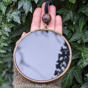 Black scrying mirror with genuine vintage frame for witchcraft and wicca divination.