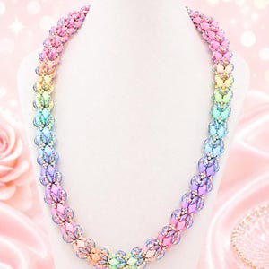 May include: A colorful beaded necklace displayed on a white mannequin. The necklace features a gradient of pastel colors, including pink, orange, yellow, green, blue, and purple. The beads are arranged in a floral pattern, creating a delicate and eye-catching design.