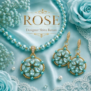 May include: A jewelry set featuring a light blue pearl necklace and matching drop earrings. The pendant and earrings showcase a floral design with light blue marquise-cut stones and gold accents. The text ROSE Designer Shira Renan is visible.