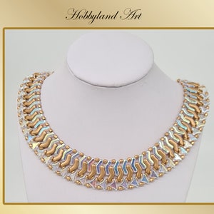 May include: A gold and iridescent beaded necklace with a geometric design. The necklace is on a white mannequin bust.