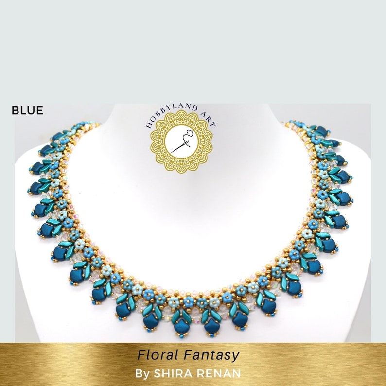 May include: A blue, teal, and gold beaded necklace with a floral design. The necklace is called "Floral Fantasy" by SHIRA RENAN.