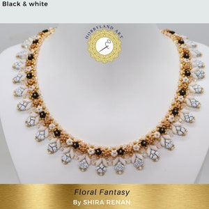May include: A white, black, and gold beaded necklace with a floral design. The necklace is called "Floral Fantasy" by SHIRA RENAN.