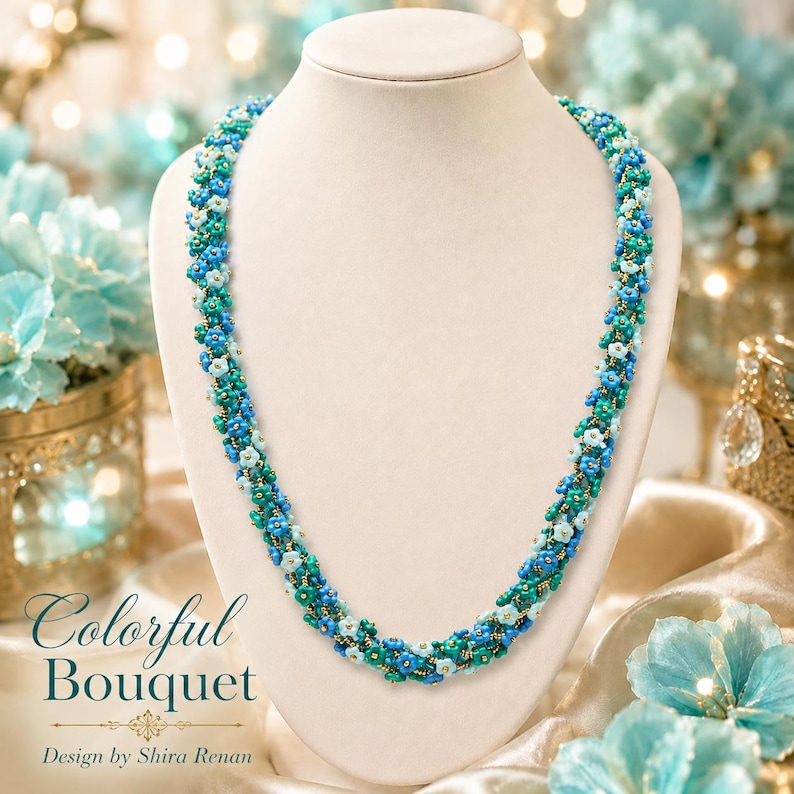 May include: A beaded necklace with a floral design, displayed on a white mannequin. The necklace features a mix of blue, teal, and white beads, with gold accents. The text "Colorful Bouquet" and "Design by Shira Renan" are visible.