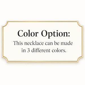 May include: A rectangular sign with a gold border and a cream-colored background. The text "Color Option: This necklace can be made in 3 different colors" is displayed in black font.