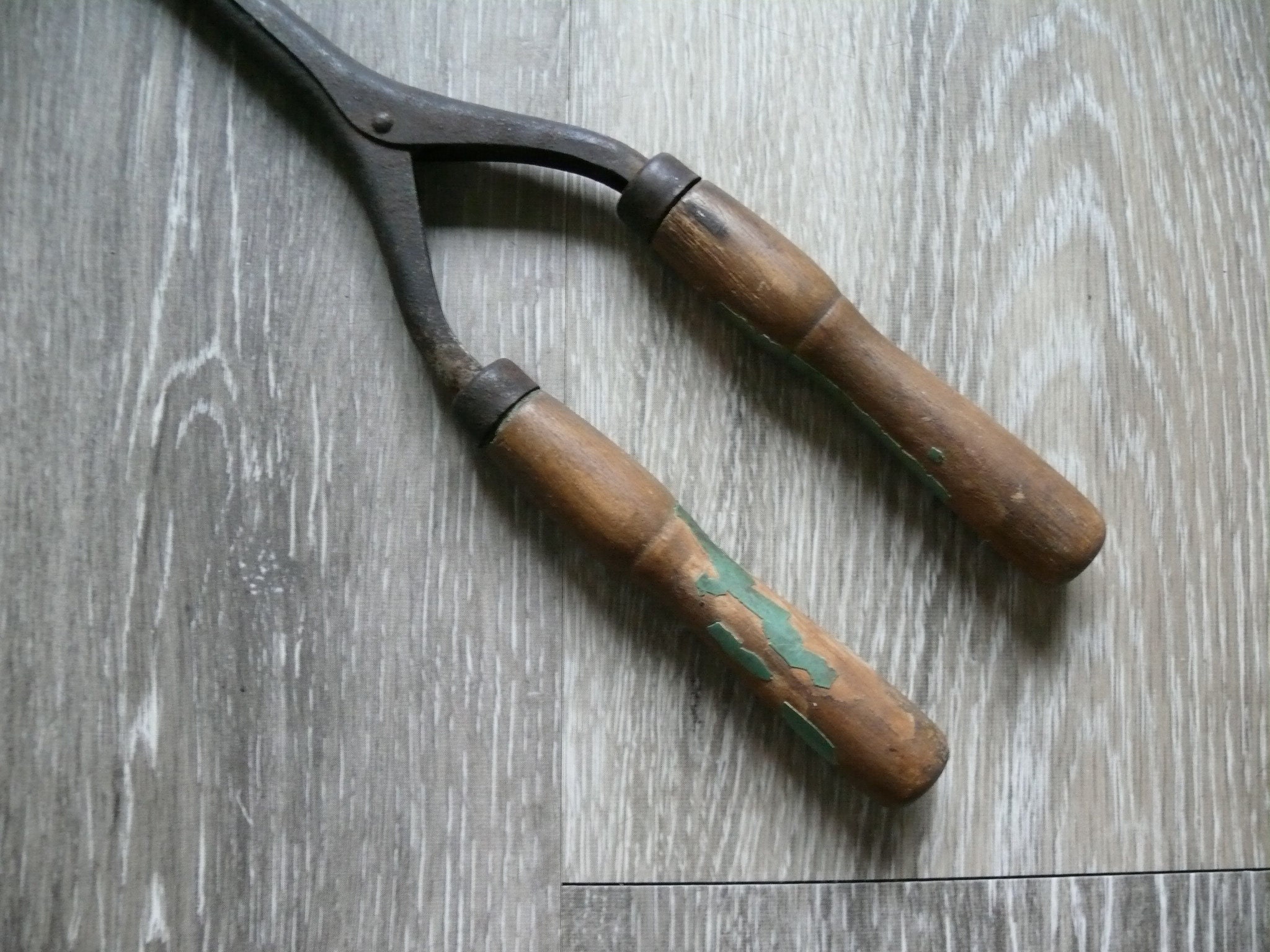 Antique curling top iron wood handles