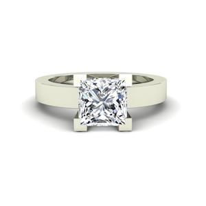 May include: A white gold engagement ring with a square-shaped diamond.