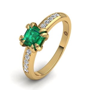 Geelgouden ring met natuurlijke smaragd en diamanten. Damesring ideaal als cadeau of als verlovings- of jubileumring. Gratis verzending.