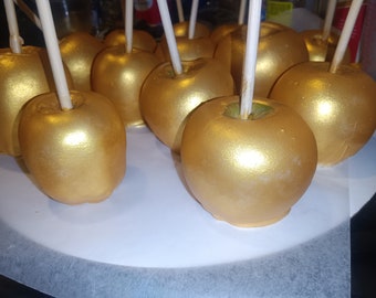 Manzanas de caramelo cubiertas de chocolate dorado