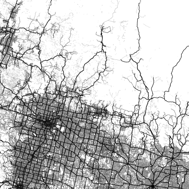 May include: Black and white aerial map of a city with a grid pattern of streets and roads. The map shows a dense urban area with a network of highways and smaller roads.