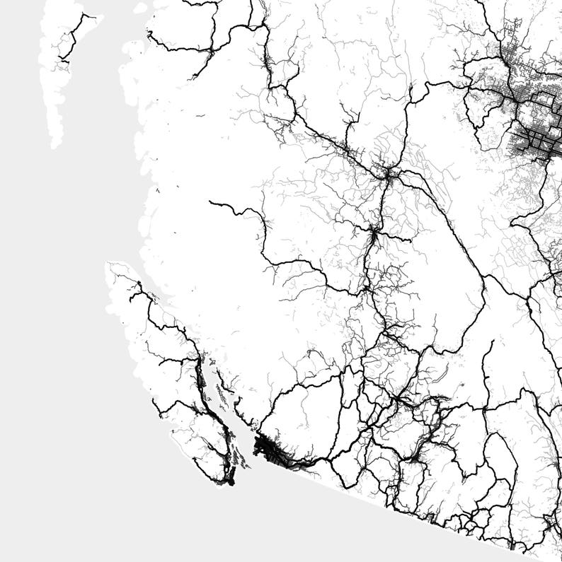 May include: Black and white map of a region with a network of roads and highways. The map shows a coastal area with a large body of water.