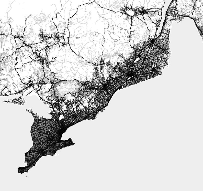May include: A black and white map of a city with a dense network of roads and highways. The map shows the city's infrastructure and transportation system.