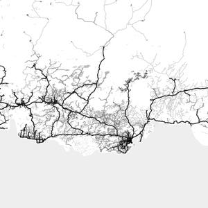 May include: A black and white aerial map of a city with a network of roads and highways. The map shows the city's infrastructure and transportation system.