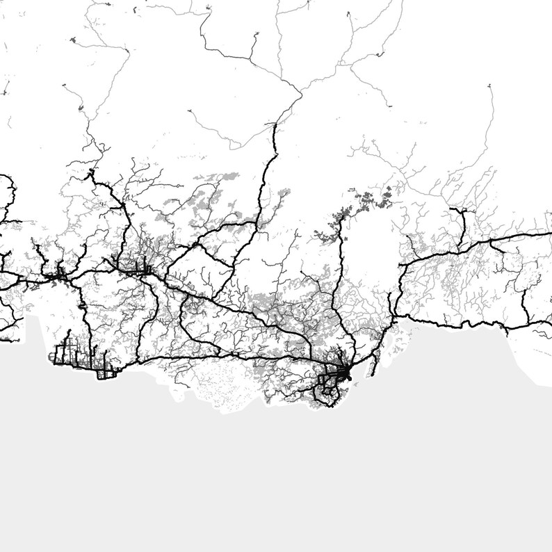 May include: A black and white aerial map of a city with a network of roads and highways. The map shows the city's infrastructure and transportation system.