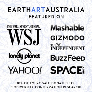 May include: Text-based graphic with the words "EARTHARTAUSTRALIA" and "FEATURED ON." Logos of media outlets such as The Wall Street Journal, Mashable, and Yahoo! are displayed. The text "10% OF EVERY SALE DONATED TO BIODIVERSITY CONSERVATION RESEARCH!" is also present.
