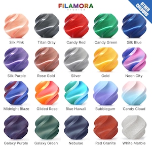 May include: A grid of 20 swirled, spherical objects in various colors, including pink, gray, red, green, blue, purple, gold, and silver. Each sphere has a unique name, such as "Silk Pink," "Titan Gray," and "Candy Red." The image includes the text "FILAMORA STUDIOS" and "OTHER COLOURS."