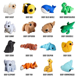 May include: A collection of sixteen small, colorful animal figurines. The figurines include a sheep, bee, whale, brontosaurus, bunny, capybara, catfish, crocodile, crow, dog, dolphin, duck, elephant, fox, giraffe, and hammerhead. Each figurine has the word "BABY" before the animal name.