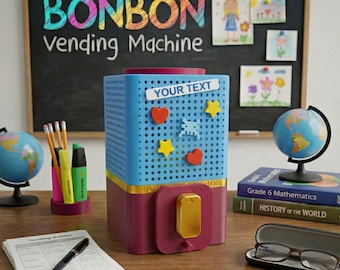 May include: A blue and maroon Bonbon vending machine with a gold dispenser. The machine has a label that says "Your Text" and is decorated with star and heart-shaped magnets. A chalkboard with the words "Bonbon Vending Machine" is in the background.