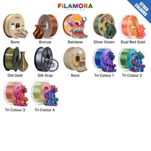 Puede incluir: Una exhibici&oacute;n de productos con varios colores de bobinas de filamento de impresi&oacute;n 3D. Los colores incluyen Bone, Bronze, Rainbow, Silver Green, Dual Red Gold, Old Gold, Silk Gray, Rock, Tri Colour 1, Tri Colour 2, Tri Colour 3 y Tri Colour 4. Marca: Filamora Studios.