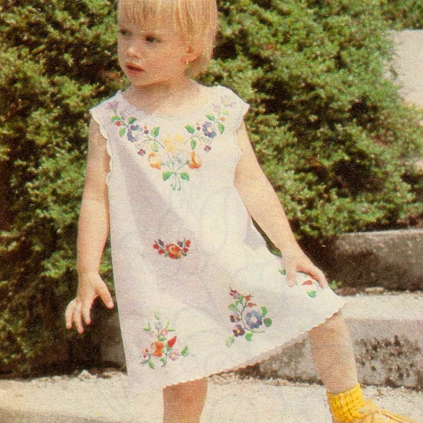 Vintage Hungarian embroidery pattern. small girl dress with kalocsai embroidery patterns flowers and heart shaped pockets