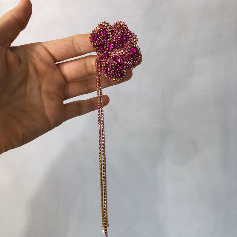 Pink flower crystal single clip on earring.