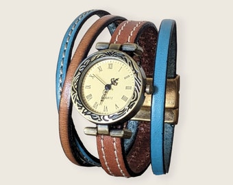 Cuff watch in brown leather and atoll blue leather, bronze dial and magnetic bronze clasp