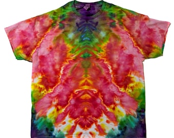 May include: A tie-dye t-shirt with a symmetrical design in shades of pink, orange, yellow, green, and purple.