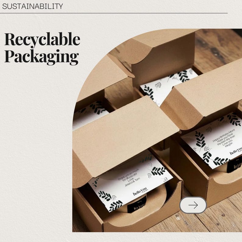 May include: Several open, brown cardboard boxes with lids, each containing a white card with a black leaf design and text. The boxes are labeled "Recyclable Packaging" and "Sustainability."