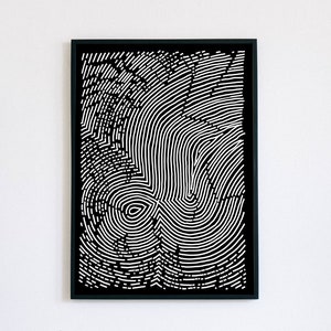 May include: Black and white abstract art print with a circular pattern resembling a fingerprint or tree rings. The print is framed in a black frame.