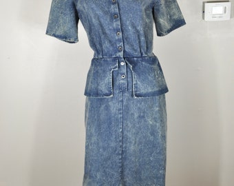 May include: A blue denim dress with a button-up front, short sleeves, and a cinched waist. The dress has a slightly faded, distressed look.