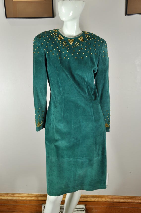 green suede dress Color Crush: Emerald Alicia Wood Lifestyle Suede Maxi DressLong SleeveCollarButton UpFront PocketsStretch88% Polyester 12% SpandexImportedAvailable In Plus Sizes Petal and Pup Women's Adair