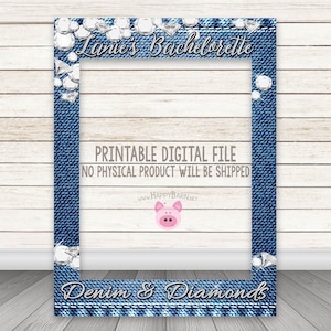 May include: A printable photo booth frame with a denim and diamond theme. The frame is blue with a white border and has a diamond pattern around the edges. The text "Lanie's Bachelorette" is at the top of the frame and the text "Denim & Diamonds" is at the bottom. The text "PRINTABLE DIGITAL FILE NO PHYSICAL PRODUCT WILL BE SHIPPED" is in the middle of the frame.